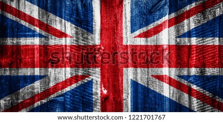 National flag of United Kingdom on a textured wooden background, fence or wall
