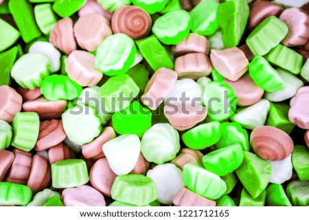 colorful homemade jelly candies as cakes as background