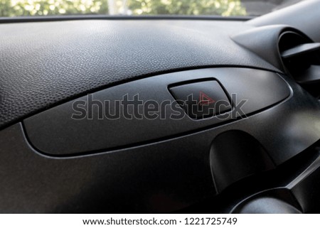 Car emergency button inside driver place.