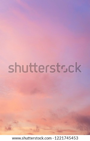 
Vertical picture of sky in the pink and blue colors. effect of light pastel colored of sunset clouds. 
