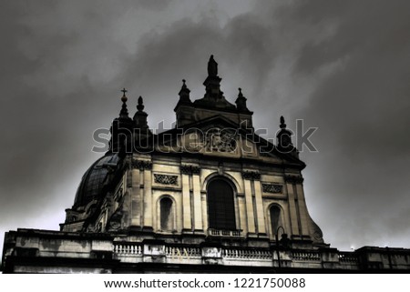 Dark Gothic Church front against grey stormy background