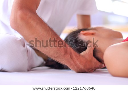 Close up of Shiatsu Therapy for head and neck tension. Royalty-Free Stock Photo #1221768640