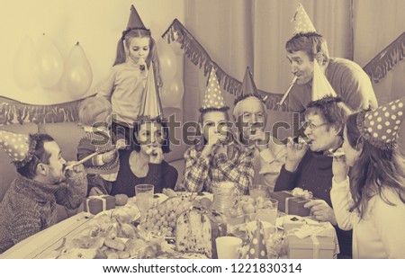 Large happy russian family having fun during children’s birthday party