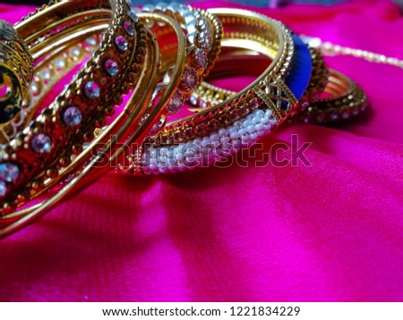 Stock photo of Beautiful designer Indian style multicolor bangle set or bracelet decorated on blur background.Picture captured under natural light at Bangalore karnataka India.