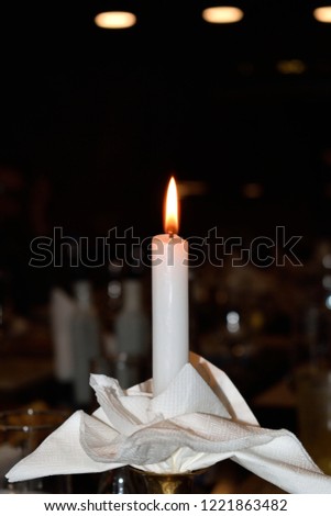 The flame of a candle with black background