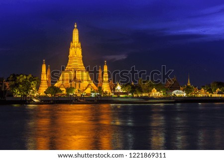 Wat Arun and cruise ship in twilight time, Bangkok city,Thailand