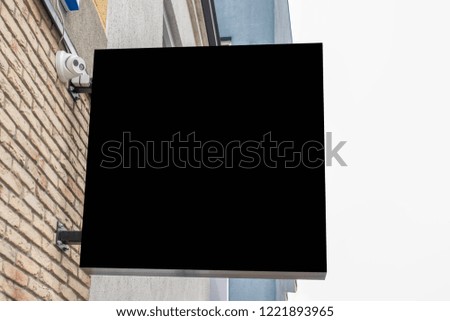 Mock up of blank black rectangular signboard on the wall