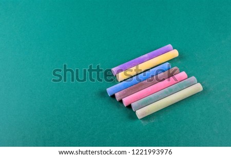 colored chalk view from above on green background