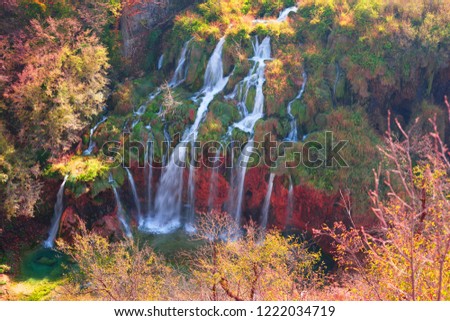 Plitvice Waterfalls in Croatia is one of the famous famous places in Europe, very beautiful. The jets of water on the background of autumn forests at sunrise are very picturesque