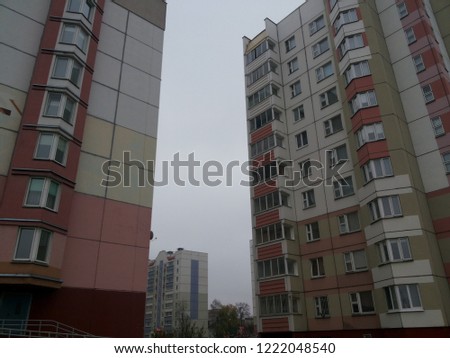 Residential buildings under rainy clouds