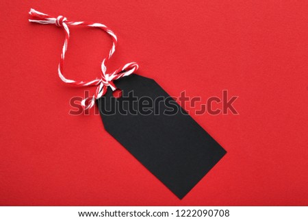 Black sale tag on red background