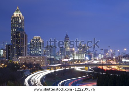 Atlanta. Image of Atlanta skyline and busy highway at night.