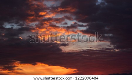 Picturesque cloudy sky. Multicolored sky orange blue grey colors. Sunrise in south of Spain