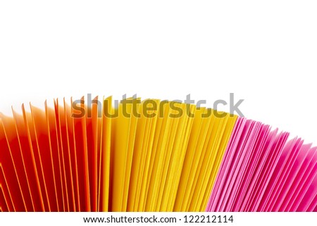 Assorted colorful papers on white background