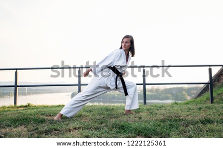 The karate girl with black belt.