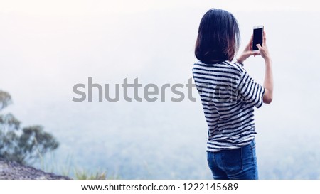Woman using take a photo phone, The concept of using the phone is essential in everyday life.