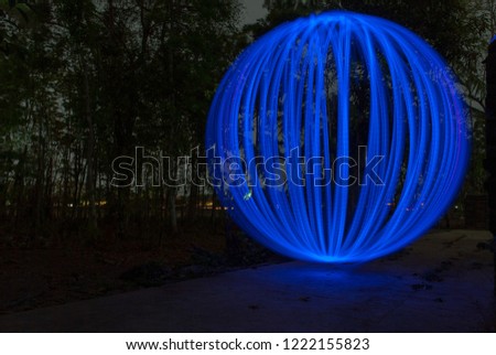blue orb - Light painting photography on backyard garden.