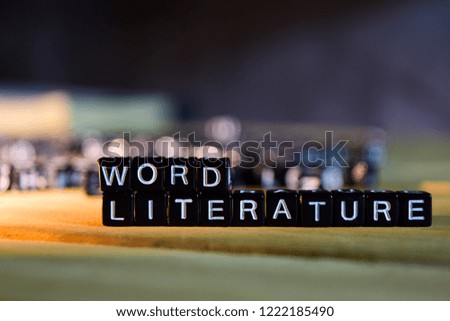 WORD LITERATURE concept wooden blocks on the table. With personal development, education and motivation concept on blurred background