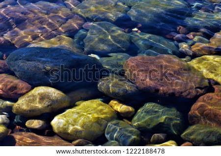Colorful rocks under water.