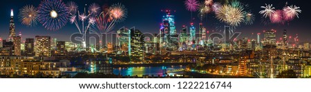 London skyline panorama at night with fireworks display 