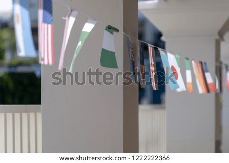 Multinational Flags hanging on a string