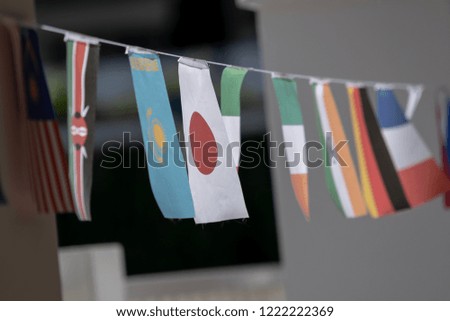 Multinational Flags hanging on a string