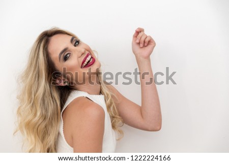 Beauty blond woman show something on the white background