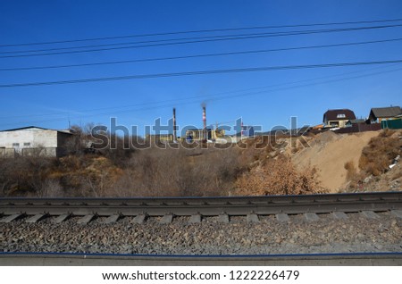 This picture shows two funnels with railroad on foreground