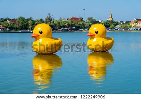 Amazing Giant yellow rubber ducks balloon floating in Nong Prajak lake Popular recreation travel destinations of Udon Thani Province unseen Thailand.