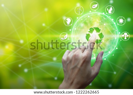 Finger touch with environment Icons over the Network connection on nature background, Technology ecology concept. Royalty-Free Stock Photo #1222262665