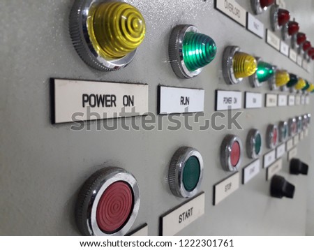Electrical panel display and push botton switch on control cablinet in industrial.