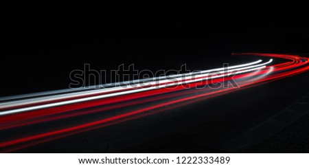 Truck light trails in tunnel. Art image . Long exposure photo taken in a tunnel 