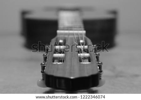 Classic Guitar On The Wooden Background (Black & White)