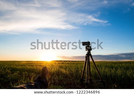 preparing to shoot the sun going beyond the horizon