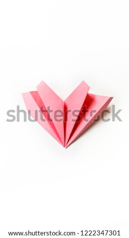 Paper folding into a Heart-shape isolate on white background