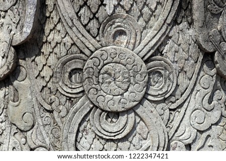 A low relief pattern depicting image of flower on stone in Wat Pho