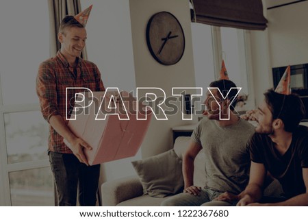 Giftbox. Happy Birthday. Present. Men. Put On. Birthday Hat. Prepar Party. Guys. Sit on Couch. Best Friend Forever. Happy Together. Celebration. Having Fun. Spend Time Together. Cheerful. Surprise.