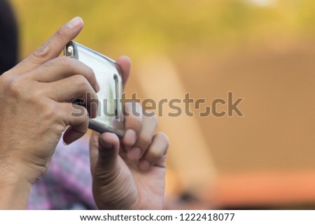 Man  using a camera.