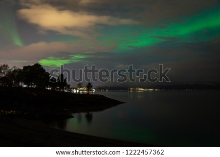 Green northern lights above Trondheimsfjorden in Ranheim, Trondheim area, Norway.