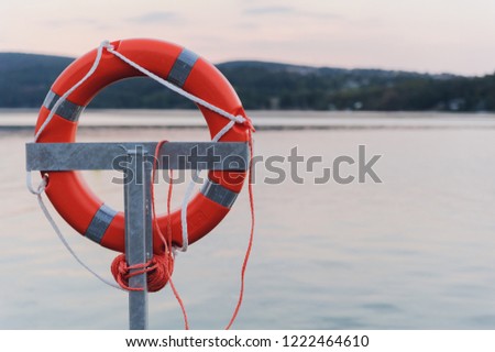 Lifebuoy on the pier of the lake