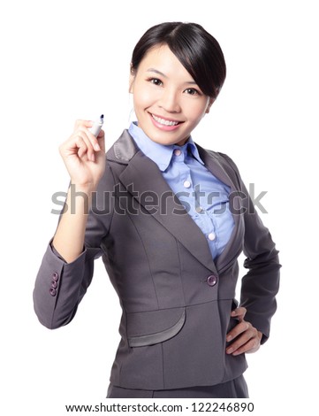 Young beautiful business woman with pen writing something in the air isolated on white background. Focus on blue maker pen. great for you add stock graph, asian woman model