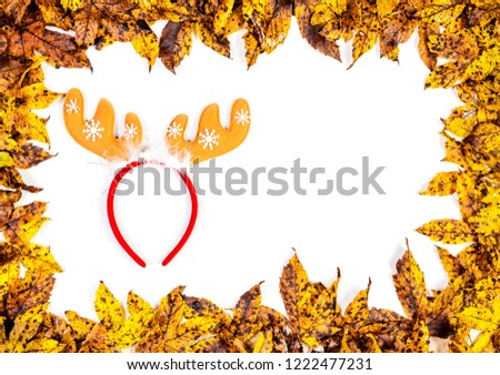 Autumn yellow leaves frame with reindeer headband isolated on white