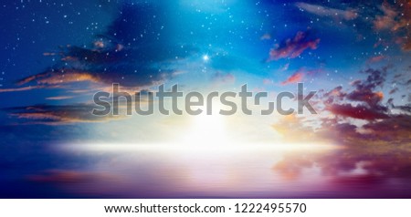 Peaceful heavenly background - way to heaven, bright light from heaven door, stars and glowing clowds above serene sea