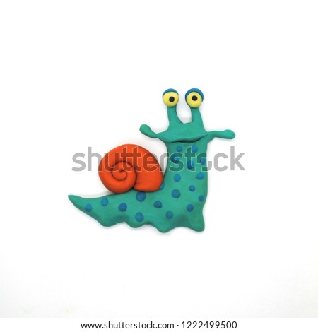 Blue Snail Cheerful plasticine character on a white background Royalty-Free Stock Photo #1222499500