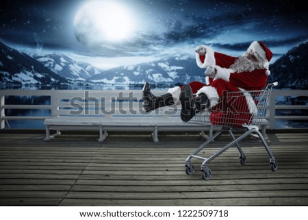 Santa Claus and wintr night. Wooden pier with bench and landscape of mountains and lake. Moon light and free space for your decoration. 