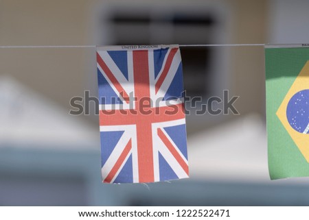 Multinational flags hanging on a string