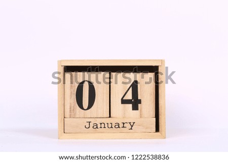 Wooden cubes calendar with the date of January 04. Concept calendar for year with copy space isolated on white background