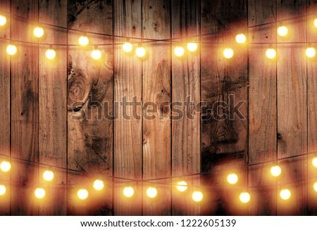 Light bulb on wooden background ,Space for your task or message. Valentine's Day concept and New year day