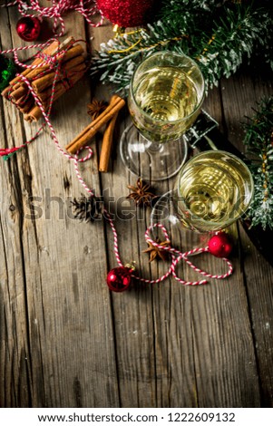 Two glasses of champagne with Christmas decoration on wooden background, Happy New Year and Xmas Celebration. Copy space