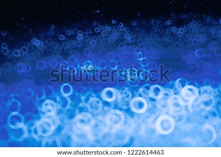 background bokeh blue rings / texture blurred background defocusing blue abstract